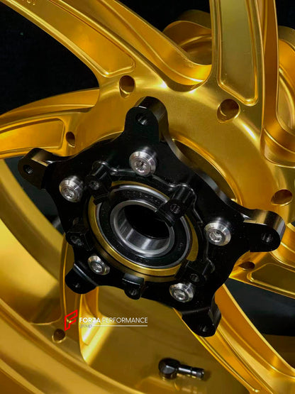 We manufacture premium quality forged motorcycle wheels rims for BMW S1000RR M1000RR in any design, size, color.

Wheel sizes (motorcycle spec):

Front: 3.5 x 17

Rear: 6 x 17

Weight:

Front: 3.6 kg (7.94 lbs)

Rear: 4.45 kg (9.81 lbs)

Finishing: Gloss Gold

Forza Performance Group engineers and manufactures each forged motorcycle wheel individually per order. This ensures precise fitment, uncompromised strength, and unique styling. Whether for racing, touring, or daily use — our wheels are built for both
