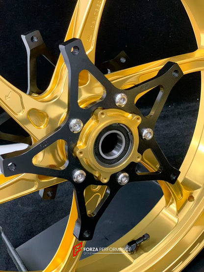We manufacture premium quality forged motorcycle wheels rims for S1000RR M1000RR in any design, size, color.

Wheel sizes (motorcycle spec):

Front: 3.5 x 17

Rear: 6 x 17

Weight:

Front: 3.75 kg (8.27 lbs)

Rear: 4.4 kg (9.7 lbs)

Finishing: Satin Gold

Forza Performance Group engineers and manufactures each forged motorcycle wheel individually per order. This ensures precise fitment, uncompromised strength, and unique styling. Whether for racing, touring, or daily use — our wheels are built for both perf