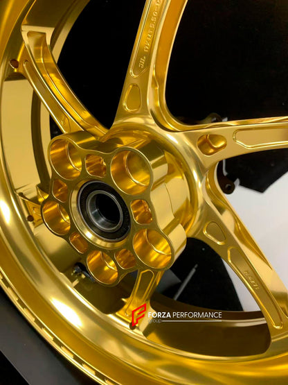 We manufacture premium quality forged motorcycle wheels rims for KTM 790 890 in any design, size, color.

Wheel sizes (motorcycle spec):

Front: 3.5 x 17

Rear: 5.5 x 17

Weight:

Front: 3.25 kg (7.16 lbs)

Rear: 4.65 kg (10.25 lbs)


Finishing: Gloss Gold

Forza Performance Group engineers and manufactures each forged motorcycle wheel individually per order. This ensures precise fitment, uncompromised strength, and unique styling. Whether for racing, touring, or daily use — our wheels are built for both pe