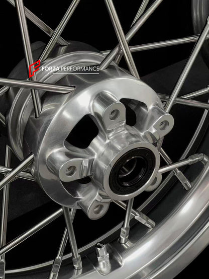 We manufacture premium quality forged motorcycle wheels rims for TRIUMPH in any design, size, color.

Wheel sizes (motorcycle spec):

Front: 3.5 x 17

Rear: 7.5 x 16

Weight:

Front: 6.95 kg (15.32 lbs)

Rear: 10.7 kg (23.59 lbs)


Finishing: Gloss Silver

Forza Performance Group engineers and manufactures each forged motorcycle wheel individually per order. This ensures precise fitment, uncompromised strength, and unique styling. Whether for racing, touring, or daily use — our wheels are built for both per