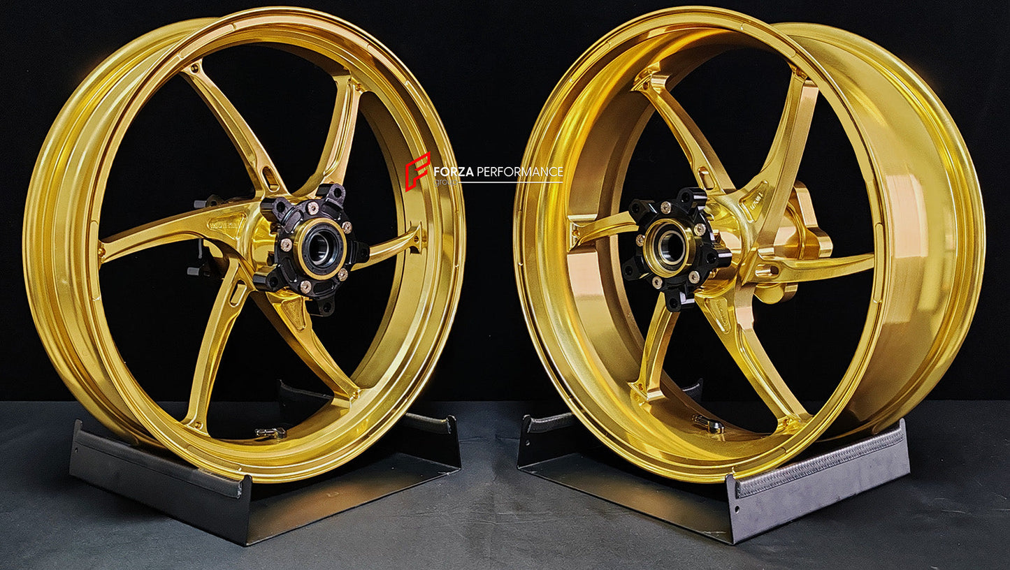 We manufacture premium quality forged motorcycle wheels rims for QJMOTOR in any design, size, color.

Wheel sizes (motorcycle spec):

Front: 3.5 x 17

Rear: 6 x 17

Weight:

Front: 3.9 kg (8.6 lbs)

Rear: 4.95 kg (10.91 lbs)


Finishing: Satin Gold

Forza Performance Group engineers and manufactures each forged motorcycle wheel individually per order. This ensures precise fitment, uncompromised strength, and unique styling. Whether for racing, touring, or daily use — our wheels are built for both performanc